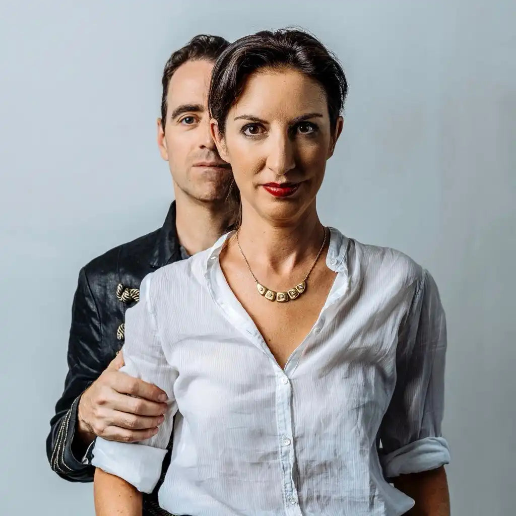 Two adults posing for a portrait.