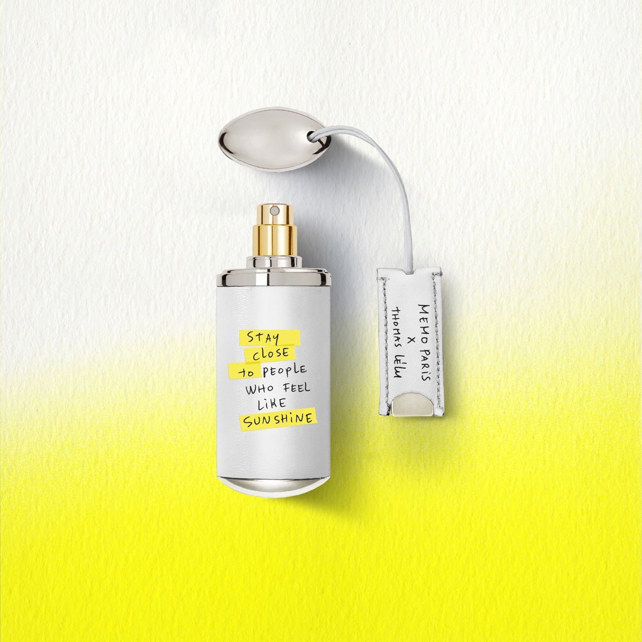 A sleek white 10ml travel size darling point perfume bottle by memo paris with gold nozzle and handwritten label — vue alternative