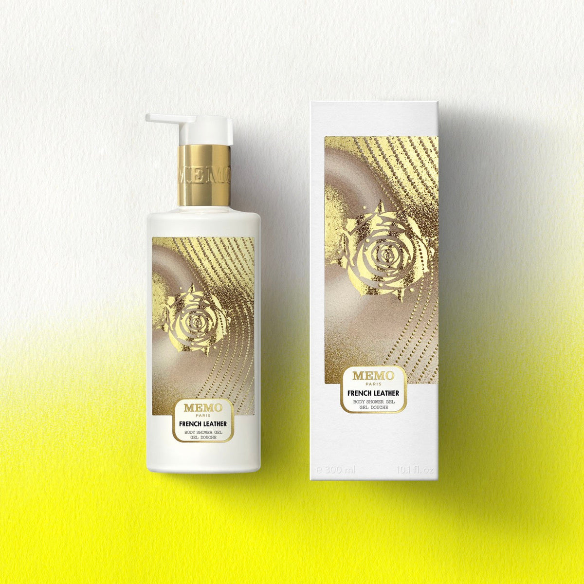 White bottle with gold pump and rose design labeled memo paris french leather shower gel for body care — vue alternative