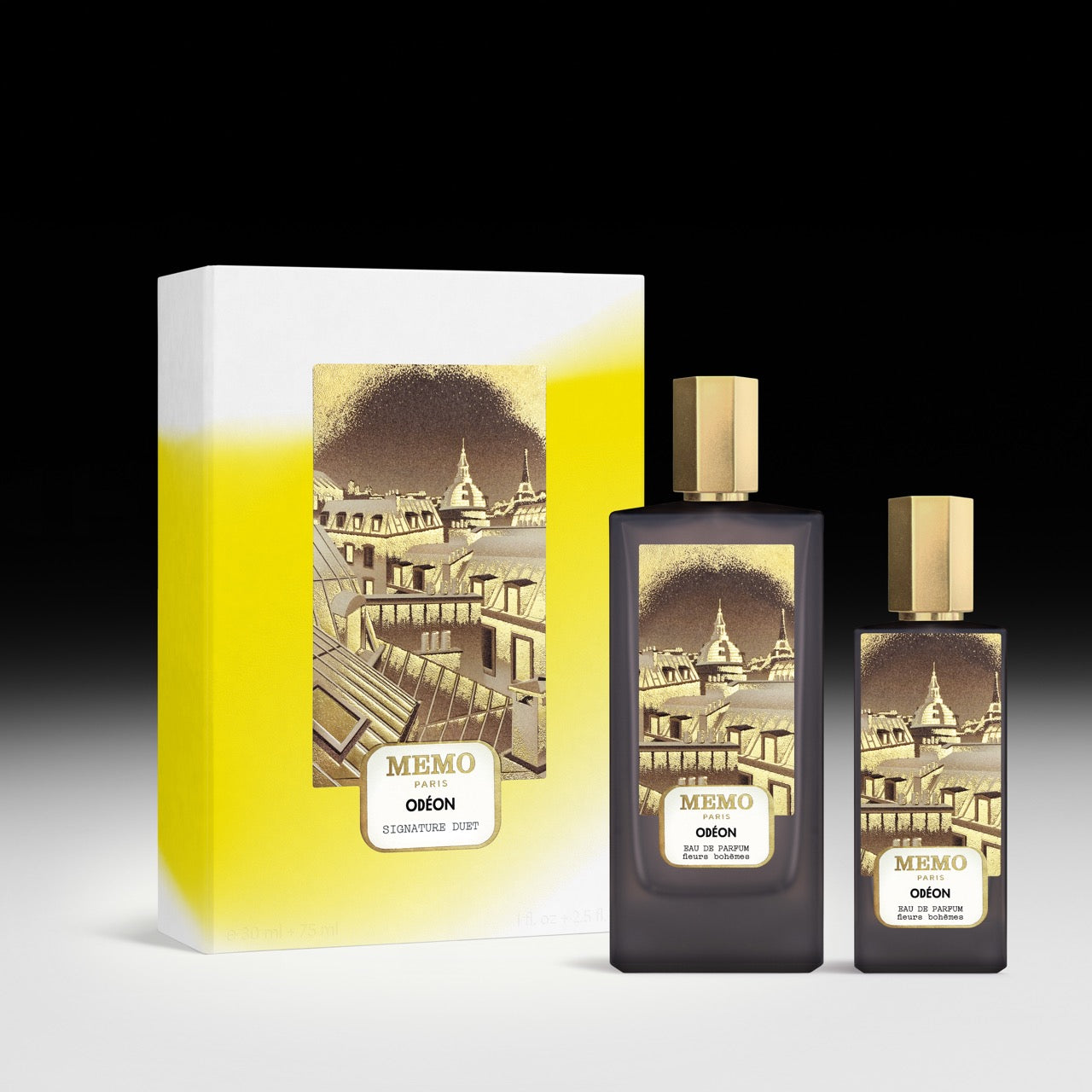 Dark glass signature duet odéon perfume bottles with gold caps and parisian skyline labels by a white yellow box